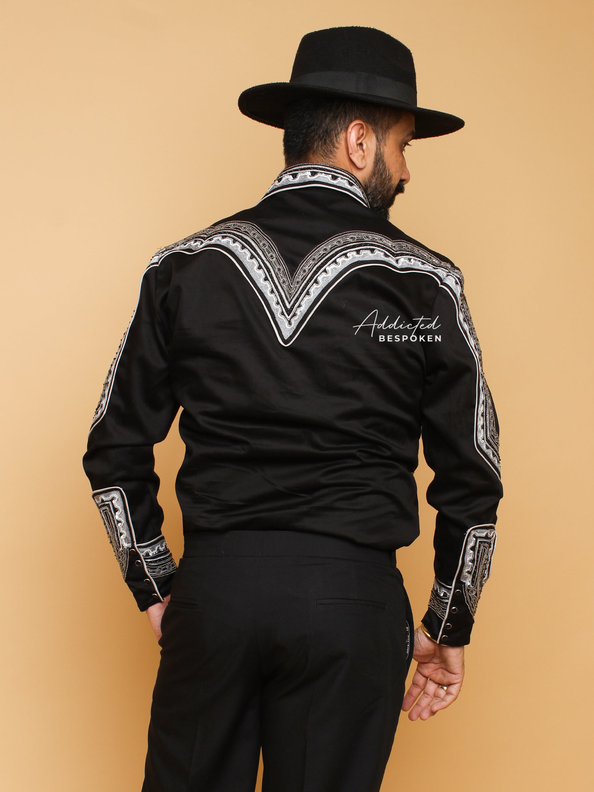 Back view of male model in black embroidered western shirt with white motif – Addicted Bespoken