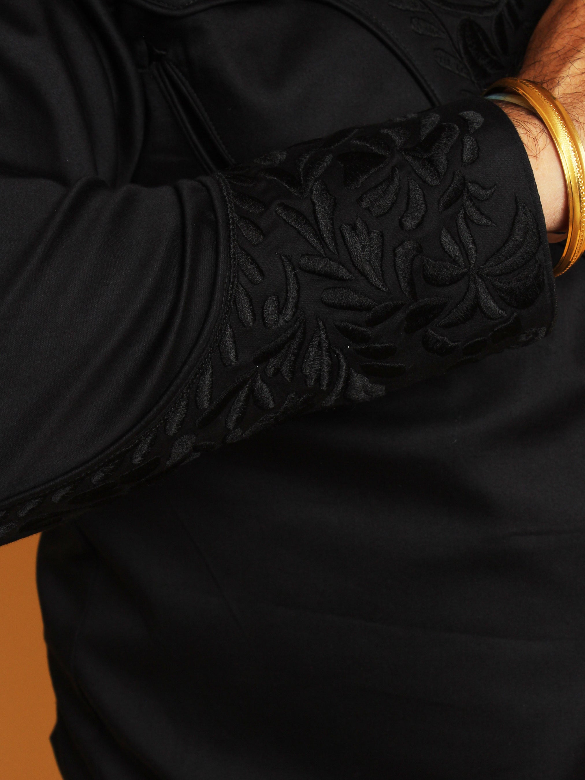 Close-up sleeve embroidery on all-black western shirt β Addicted Bespoken