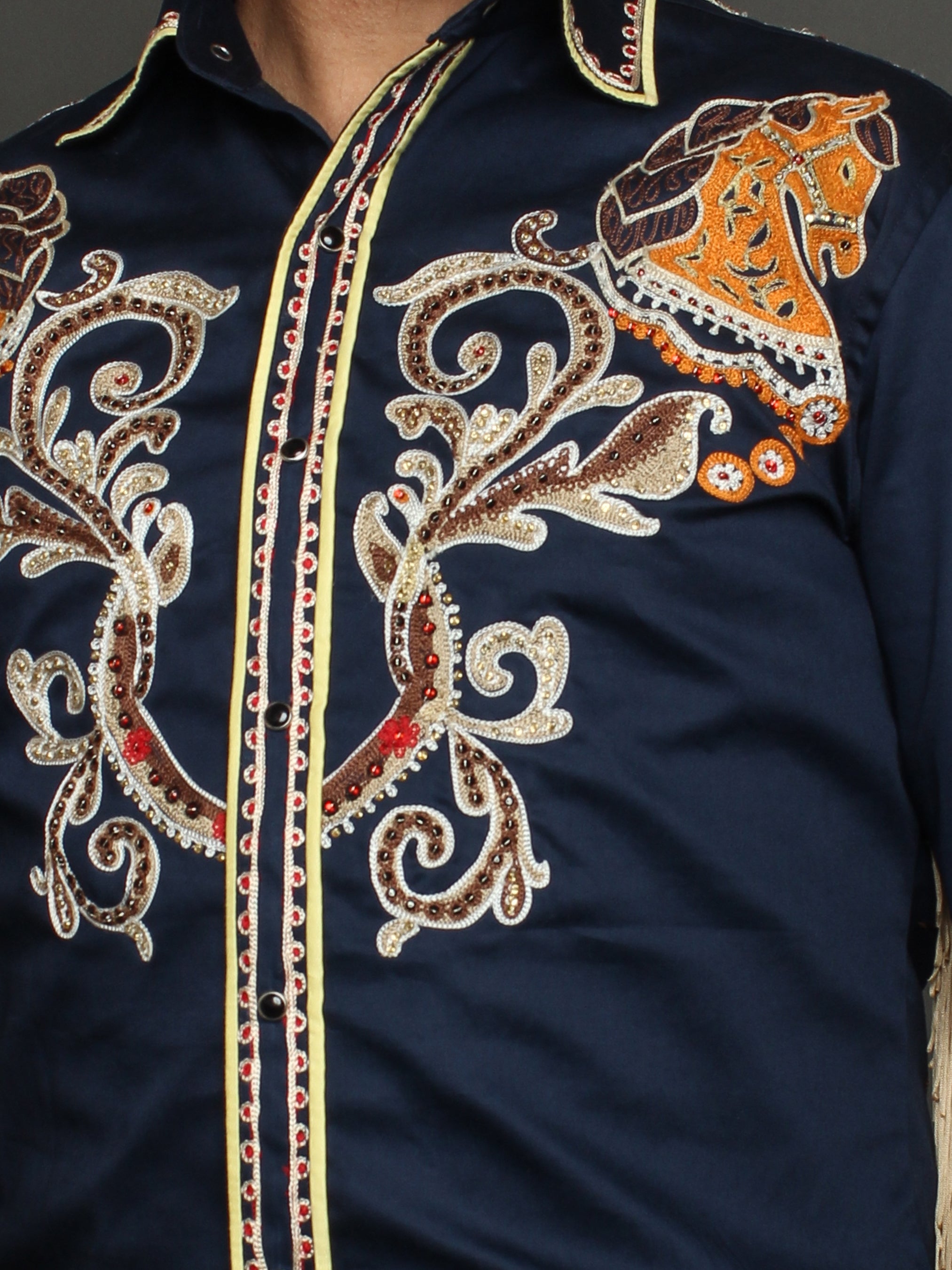Close-up chest embroidery detail of navy blue western shirt with golden motifs β Addicted Bespoken