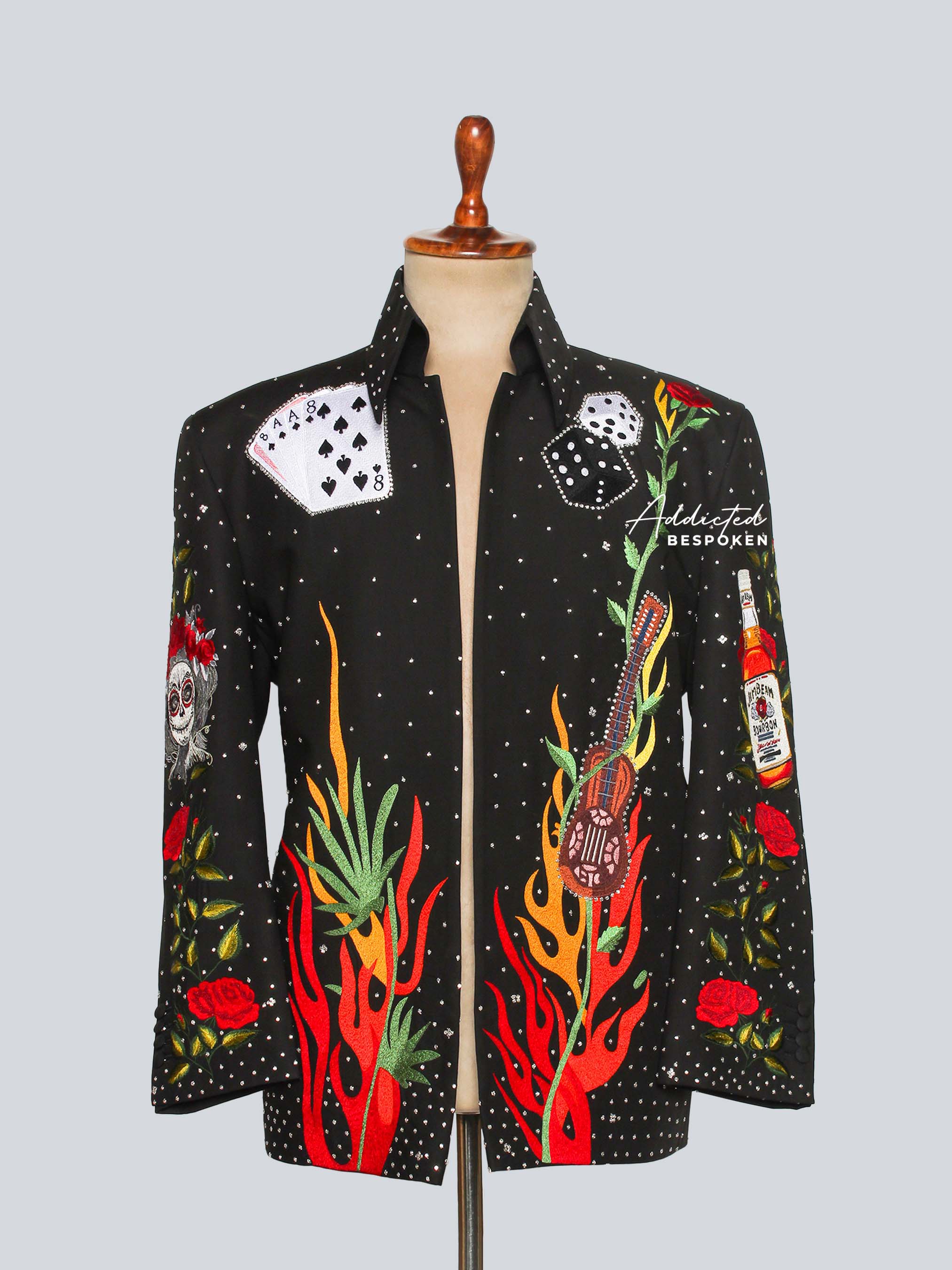 Black jacket with colorful designs on a mannequin against a light gray background