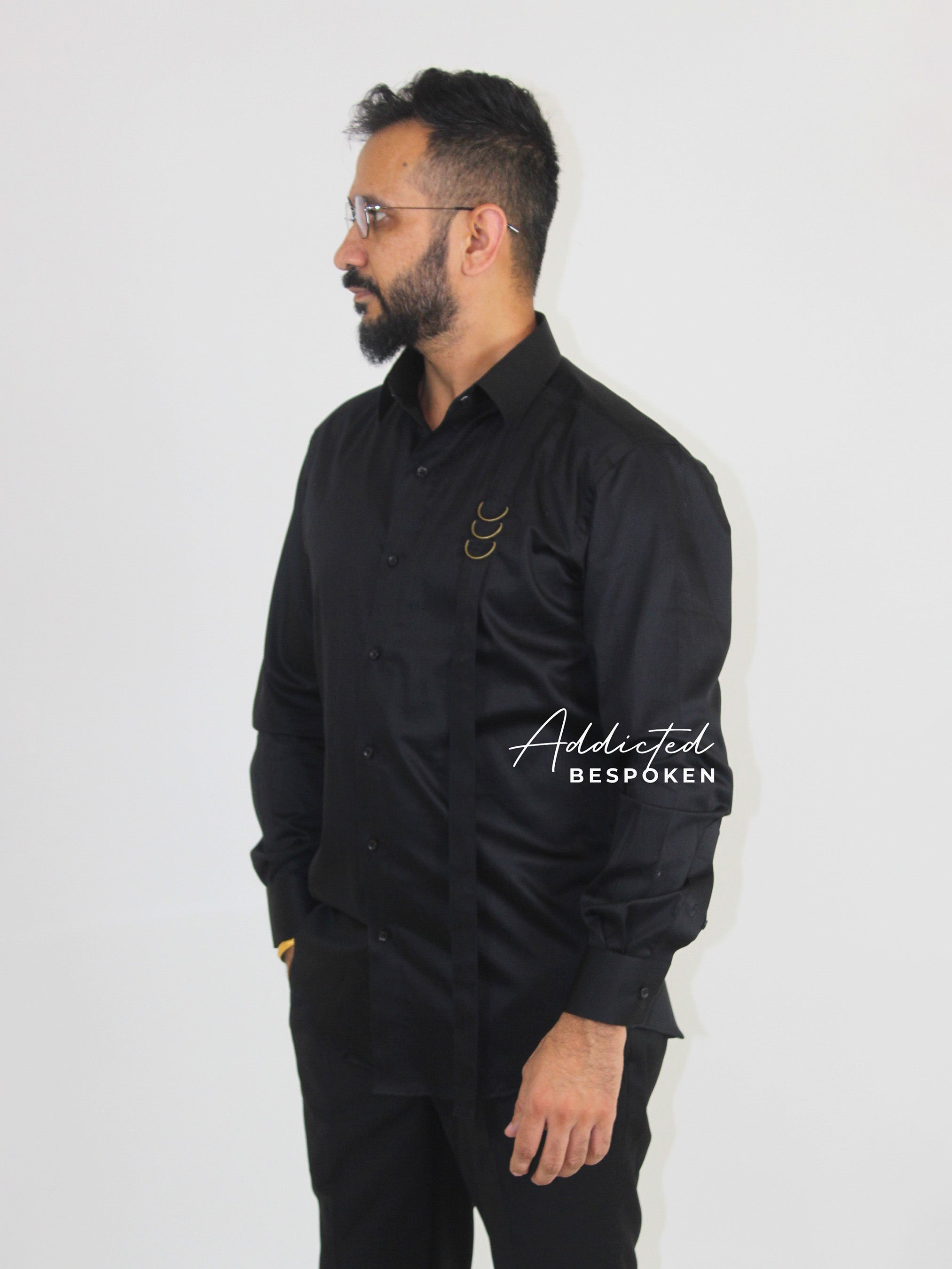 Side angled view of male model in black embroidered shirt – Addicted Bespoken