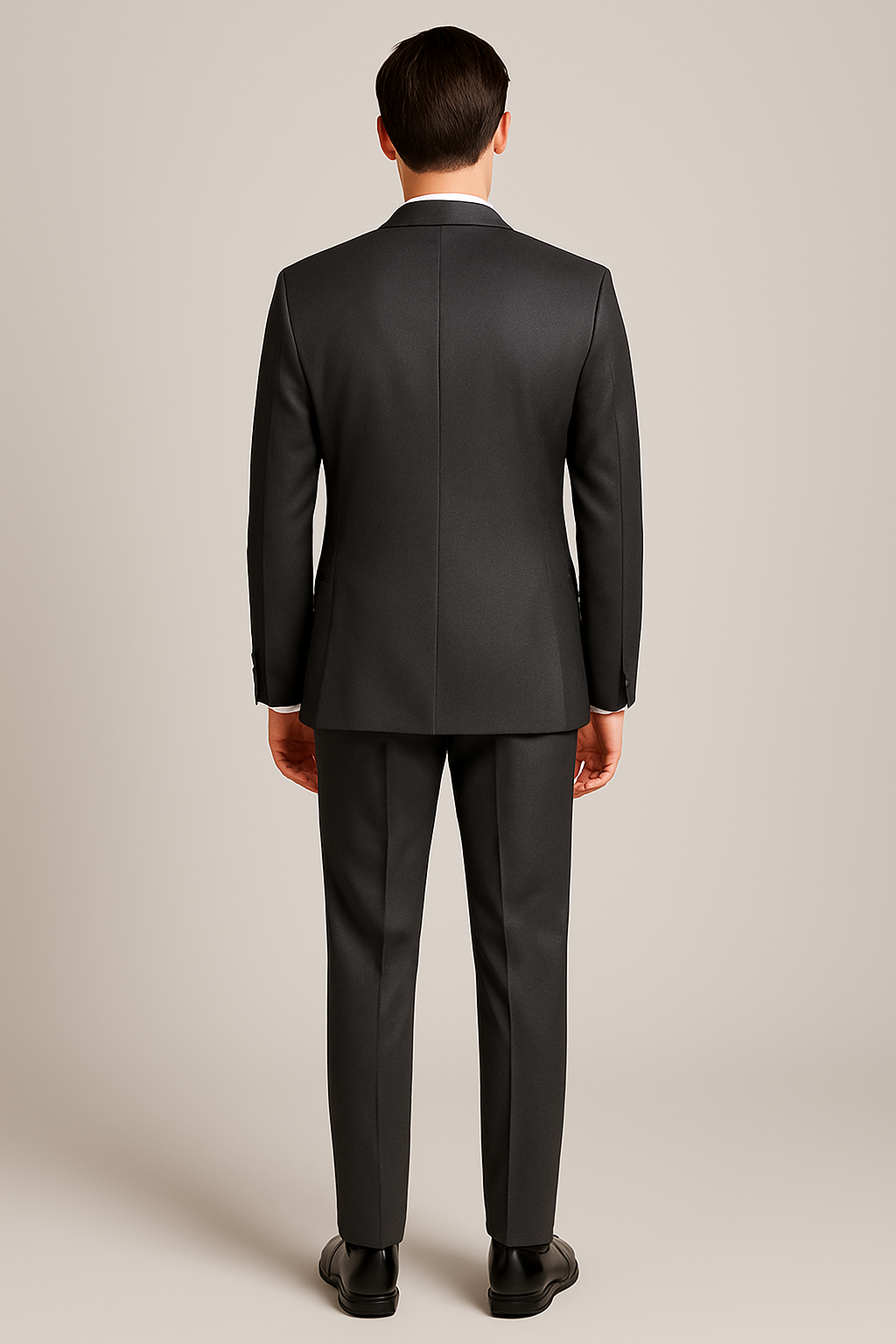 Man wearing a gray suit on a beige background