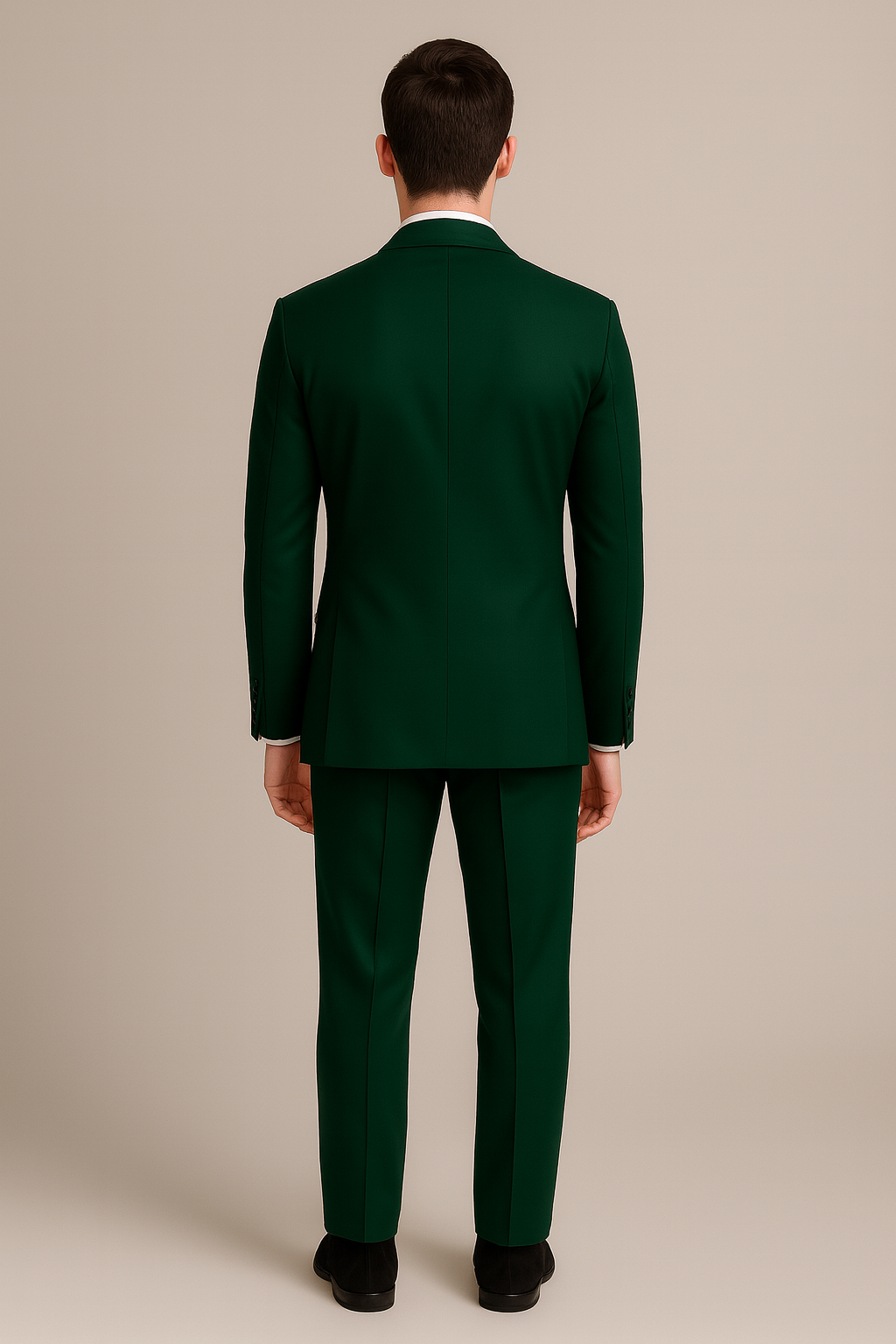 Man wearing a green suit against a beige background